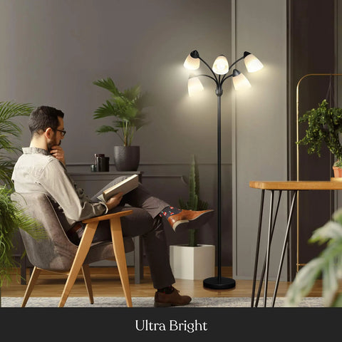 Five Head LED Floor Lamp With Dimmable 4000 Lumens, Tall Adjustable Standing Light illuminating a man reading in a living room