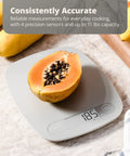 Go-To Slim Digital Kitchen Scale With 1g Precision featuring papaya on display, showcasing easy tare and quick unit conversion.
