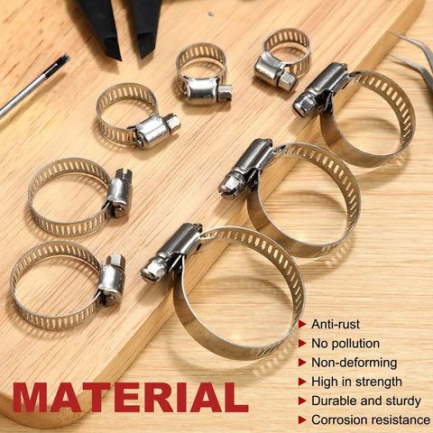 Various sizes of 304 stainless steel worm gear clamps from the Three Hundred Piece Hose Clamp Set With Eight Sizes Ranging From Quarter Inch To One And Three Quarters Inch 304 Stainless Steel Worm Gear Clamps For Automotive Fuel Lines Intercooler Radiator displayed on a wooden surface, highlighting anti-rust and corrosion resistance features.