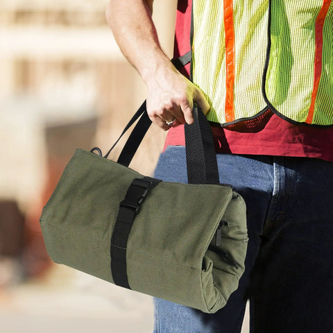 Person carrying Sturdy Canvas 16oz Tool Roll Up Bag For Wrenches And Tools, Grab And Go Multi Purpose Organizer with Five Zipper Pockets.
