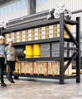 Built Tough Four Tier Metal Storage Shelves featuring massive 5000 LB load limit in warehouse with shelves of boxes and tools.