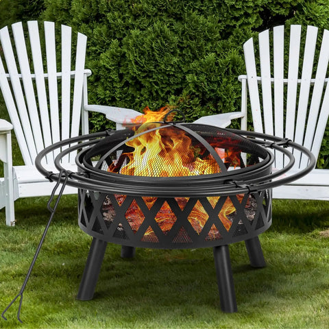 36 Inch Wood Burning Fire Pit with Spark Screen and Fire Poker in yard, featuring durable steel cross weave design built for bonfires.