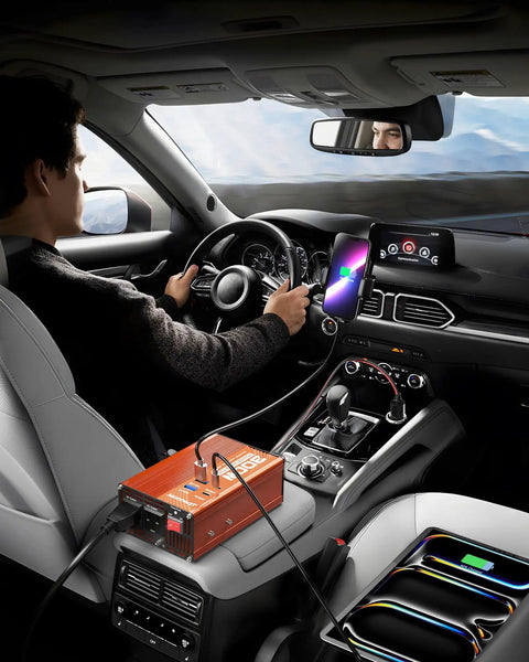 Man driving with Straight Up Reliable 300W Car Power Inverter DC 12V To 110V AC Converter in car, charging devices.