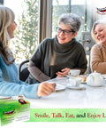 Group of smiling women drinking tea with DIY At Home Dental Repair Kit For Missing Or Damaged Teeth With Color Matching Compound visible