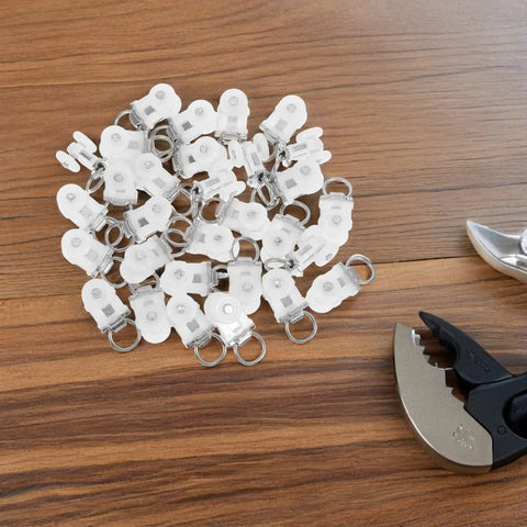 30 Pcs Heavy Duty Double Wheel Curtain Track Rollers Providing A Slam Dunk Upgrade With Durable Alloy Plastic Build And Silent Glide For Foolproof Room Refresh laid out on wood surface with tools.