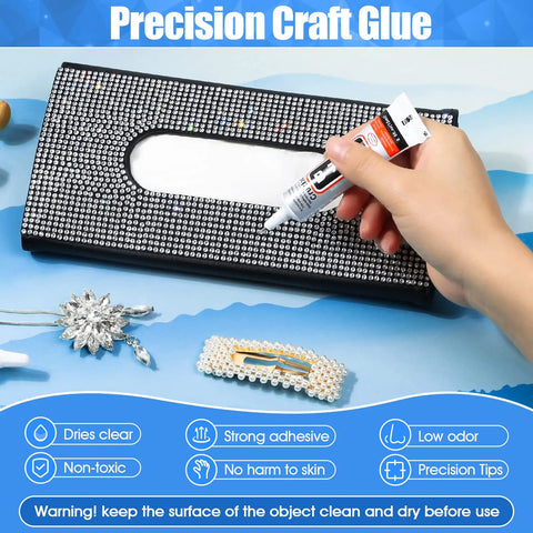 Hand applying Clear Rhinestone Glue for Jewelry and Crafts on a decorated fabric clutch, semi-fluid high viscosity adhesive