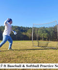 Person practicing pitching with Heavy Duty 7x7ft Portable Baseball And Softball Practice Net With Carry Bag for batting, hitting, and pitching.