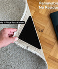 Hand lifting corner of rug showing 25 Pieces Non Slip Rug Tape Set With Triangular Grippers for Hardwood Floors, 4" x 4" x 5.4"