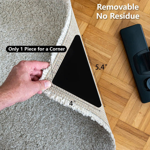 Hand lifting corner of rug showing 25 Pieces Non Slip Rug Tape Set With Triangular Grippers for Hardwood Floors, 4" x 4" x 5.4"