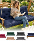 Woman relaxing on navy 60 Inch Waterproof Porch Swing Cushions For 2 To 3 Seaters, Outdoor Bench Cushion with backrest straps