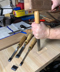 Built Tough 4 Piece Bench Chisel Set For Serious Woodworkers Carved From Top Shelf Chrome Vanadium Steel Blades in use on wood.