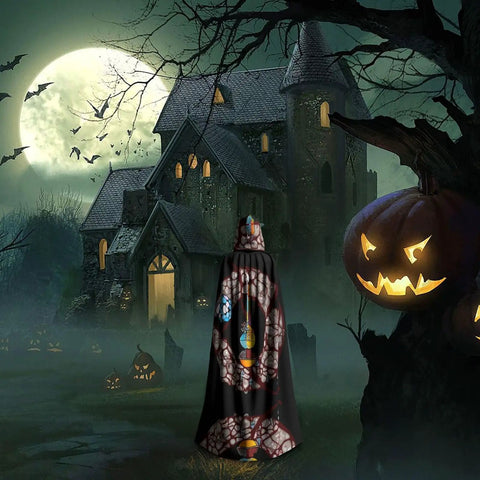 Person wearing Halloween Adult Hooded Cape With Full Body Transfer Print standing in front of a haunted house at night.