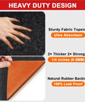 Close-up of Oil Spill Mat For Garage Floor 64x32 Inches showing absorbent fabric topside and orange rubber backing, heavy-duty design.