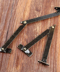 2 Pack Left Side Lid Support Hinges Fold Up Stay Hinges for Wood Boxes Cabinets Jewelry Boxes Toy Chests and Gift Boxes 4.25 Inch by 0.43 Inch Zinc Alloy Durable Hardware on wood surface
