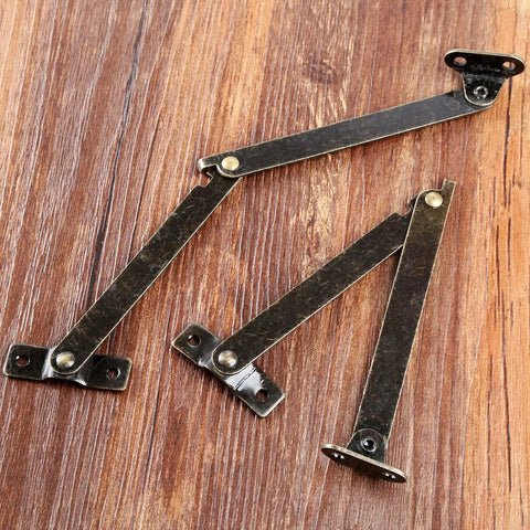 2 Pack Left Side Lid Support Hinges Fold Up Stay Hinges for Wood Boxes Cabinets Jewelry Boxes Toy Chests and Gift Boxes 4.25 Inch by 0.43 Inch Zinc Alloy Durable Hardware on wood surface