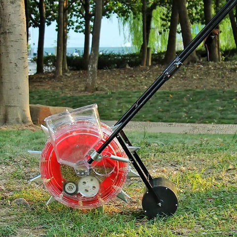 Manual Seeder For Garden Use, Metal Precision Push Seeder With Clear Seed Storage Box in a garden setting