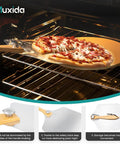 Aluminum Pizza Peel And Rocker Cutter Set 12 By 14 Inch With Foldable Wooden Handle Lightweight Stainless Steel Finish Pizza Paddle For Oven And Outdoor Pizza Maker No Fuss Sliding And Lifting Includes Storage Bag in use with a pizza in the oven.