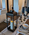 Huge Outdoor Solar Powered LED Candle Lantern 18 Inch Tall Open Frame Black Metal on dining table indoors