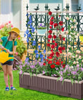Raised Garden Bed Planter Box With Trellis 61.4 Inch Self Watering System For Climbing Plants in outdoor setup with flowers.