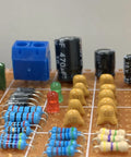 Ceramic Capacitor Assortment Kit With 32 Values, 800 Pieces, From 10pF To 10uF, 50V, on circuit board with resistors and LEDs.