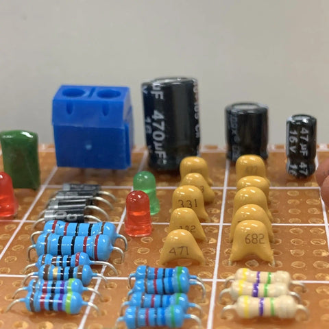 Ceramic Capacitor Assortment Kit With 32 Values, 800 Pieces, From 10pF To 10uF, 50V, on circuit board with resistors and LEDs.