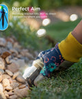 Person adjusting Vibe Eternity Garden Lights 50 Foot Outdoor RGBWIC LED Uplights Kit in a garden with stones and bright LEDs.