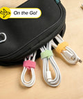 Macaron 40 Pack Self Gripping Cable Ties With 5 Inch And 8 Inch Straps organizing cables in a pouch on a table