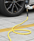Hybrid Air Hose 1/4 Inch By 100 Feet Built Tough No Kink 300 PSI Heavy Duty being used to inflate car tire with gauge