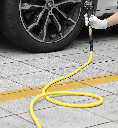 Hybrid Air Hose 1/4 Inch By 100 Feet Built Tough No Kink 300 PSI Heavy Duty being used to inflate car tire with gauge
