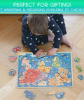 Child playing with World Map Wooden Puzzle For Kids Ages 4 To 6: Learn Continents And Oceans With Landmarks, Animals And Marine Life.
