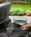 Person using Steam Activated Grill Brush With ArmorTec Bristle Free Mesh Powered By Scrub Daddy For Quick Beast Mode Grate Cleaning
