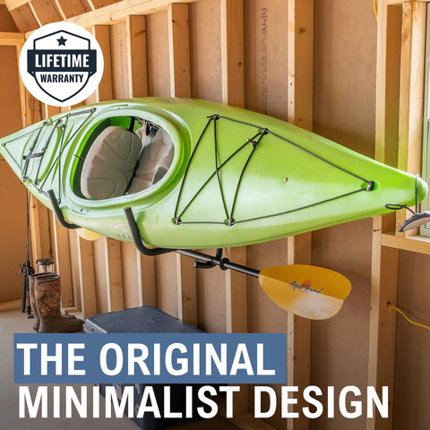 Heavy Duty Swivel Kayak Rack For Garage Walls That Folds Flat Saves Floor Space Keeps Your Watercraft Secure While Delivering Badass Storage Vibes For All Water Enthusiasts, supporting a green kayak on a garage wall.