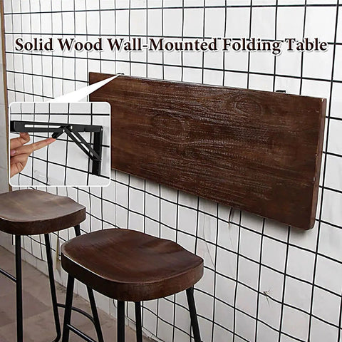 Folding Wall Desk With Solid Wood Board And Two Iron Brackets, 2.8cm Thick, shown folded on wall in cafe setting.