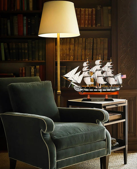 Old Ironsides Dope Wooden Model Ship USS Constitution 1 To 155 Scale Replica in a home library setting with armchair and lamp