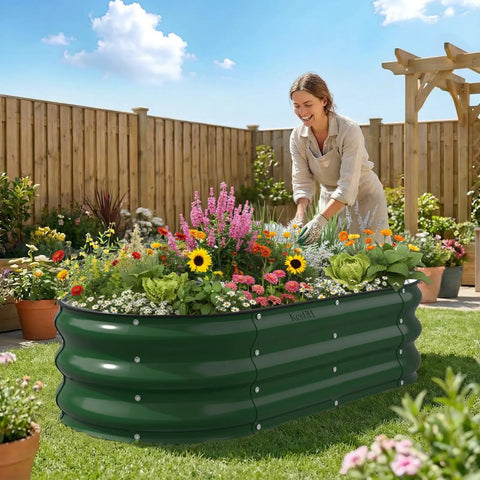 Sturdy Galvanized Steel Raised Garden Bed With 12 Inch Depth Oval Open Bottom Design Yard Ready No Fuss For Outdoor Veggies And Herbs 4X2 Foot Frame Easy Ground Level Gardening Forest Green shown outdoors with plants