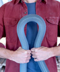 Person holding Pro Grade Wet Dry Vacuum Hose Attachment Kit 1.875 Inch Diameter Locking Hose Industrial Grade