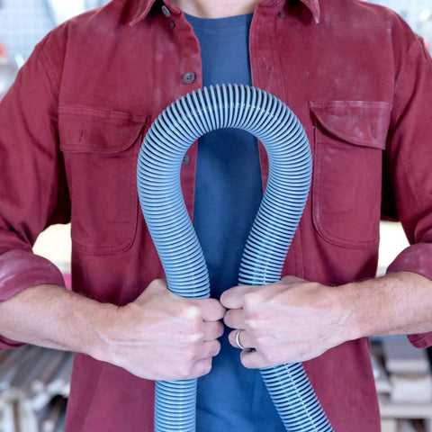 Person holding Pro Grade Wet Dry Vacuum Hose Attachment Kit 1.875 Inch Diameter Locking Hose Industrial Grade