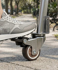Close-up of 4 Pack 1.5 Inch L Shaped Side Mount Swivel Plate Caster Wheel with Locking Brake in use outdoors