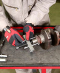 Mechanic using Five Inch Timing Gear And Pulley Puller For Removing Timing Gears And Pulleys With Tapped Holes Crankshaft Gears And More