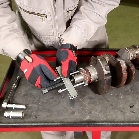 Mechanic using Five Inch Timing Gear And Pulley Puller For Removing Timing Gears And Pulleys With Tapped Holes Crankshaft Gears And More