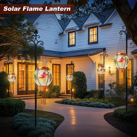 Solar Hot Air Balloon Lantern With Flamingo Pattern illuminating garden path at night