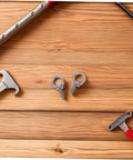 Stainless Steel Eyebolts With Closed Ring M6x20 For Heavy Duty Hanging, Beefy Load Bearing Eye Bolts With Washer And Nut, Concrete Or Wood Anchor Screws, Durable, Secure Mounts For Outdoor Gear Or Equipment, shown with two M6 eyebolts on wood