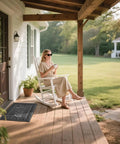 Woman sitting on porch near Tough As Nails Heavy Duty Welcome Mat For Home Entrance Indoor Outdoor Front Porch Door Mat 29.5x17 Waterproof