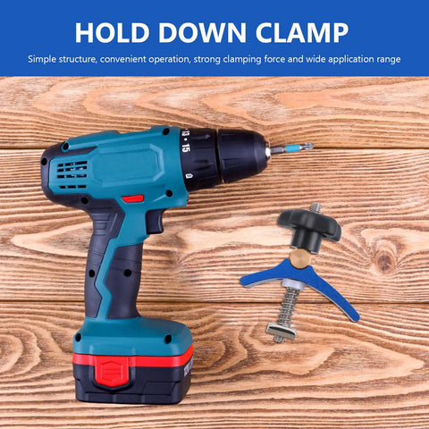 Beefy Woodworking T Slot Clamp With T Track Hold Down Screw Blue Quick Act Carpenter Clamp next to a blue power drill on wood surface