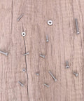 Top Shelf 390 Piece Machine Screw Assortment Kit featuring various Phillips pan head screws and hex nuts on a wooden surface.