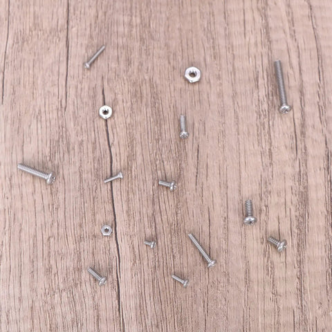 Top Shelf 390 Piece Machine Screw Assortment Kit featuring various Phillips pan head screws and hex nuts on a wooden surface.