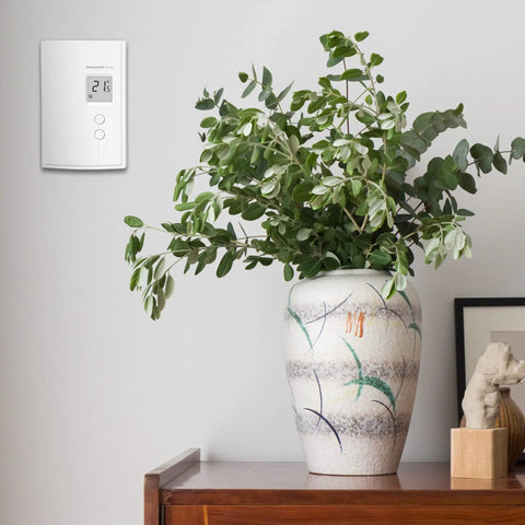 Digital Non Programmable Thermostat For Electric Baseboard Heaters And Convectors mounted on wall.
