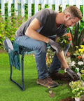 Man using Kneeler Seat For Gardening Portable 2-In-1 Garden Kneeling Chair With Handles And Tool Pouches while tending flowers.