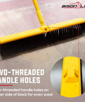 Real Deal Heavy Duty Multi Surface Push Broom featuring stain resistant coarse polypropylene bristles and solid plastic block head, showing handle holes.
