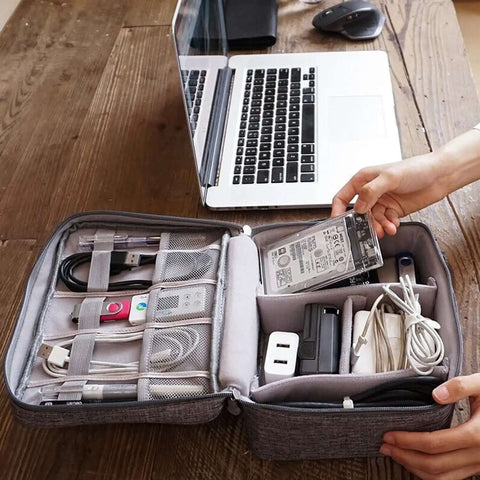 Hella Organized Travel Case For Small Electronics And Usb Charging Gear Including Phone Cables Mouse Sd Cards Power Bank Earphone Bag with open compartments and cables.